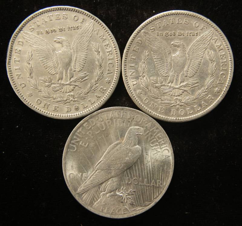 lot 84 image: (3) HIGHER GRADE SILVER DOLLARS 1879 1890-S MORGANS & 1923 PEACE