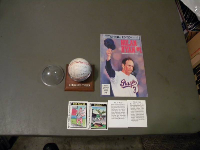 lot 68 image: MN Twins Autographed Baseball & Nolan Ryan Comic