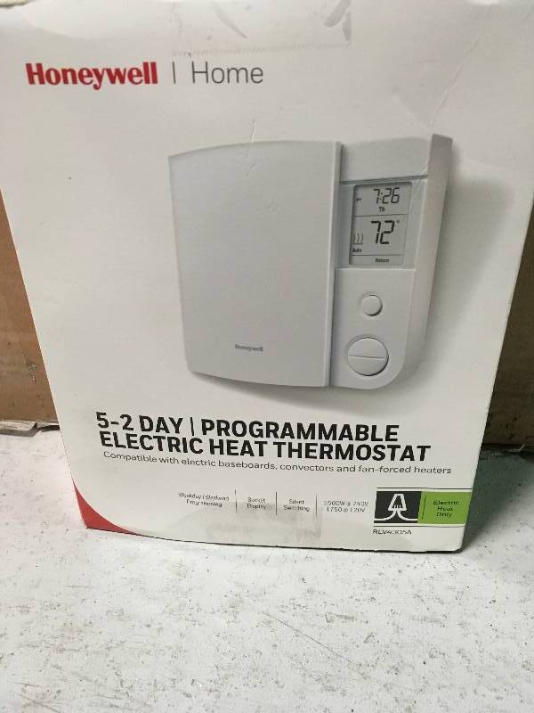 lot 73 image: Honeywell RLV4305A1000E 5-2 Day Programmable TRIAC Line Volt Thermostat in good conditions