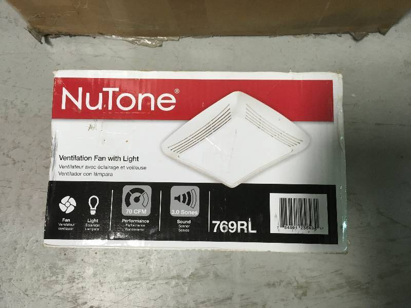 lot 79 image: Nutone 70 CFM Ceiling Exhaust Fan with Light, White Grille and Bulb in good conditions