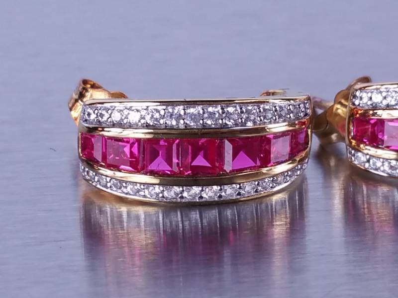 lot 33 image: Ruby and Diamond Earrings