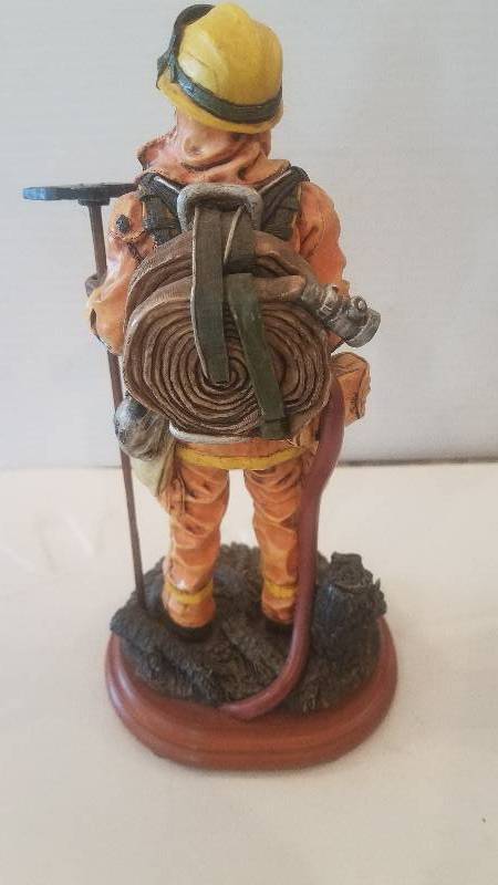 lot 56 image: Fire Fighter Ceramic Statue
