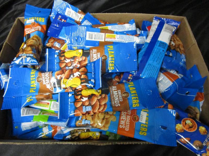 lot 145 image: 40 Various Flavor and Size Planter Nuts and Snacks