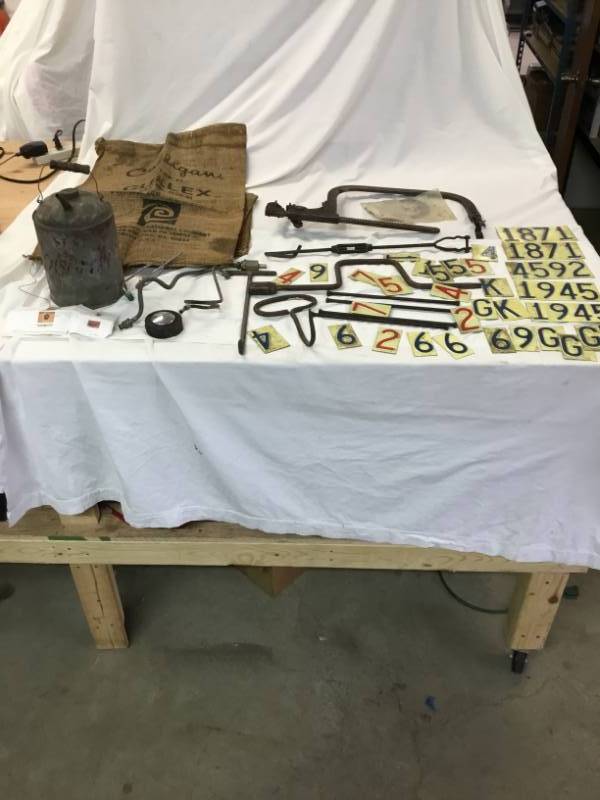 3 Culigan Gunny Sack - Waterloo Valve Spring, Metal Oil Can, Gas Piping, License plate pieces.