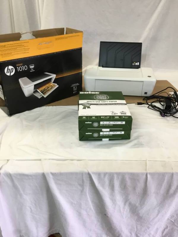 Hp DeskJet 1010 Printer and two reams of paper