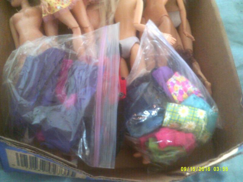 lot 26 image: BARBIES AND CLOTHS