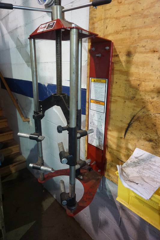 lot 4 image: Brannick Model 7400 Wall Mount Strut Spring Compressor