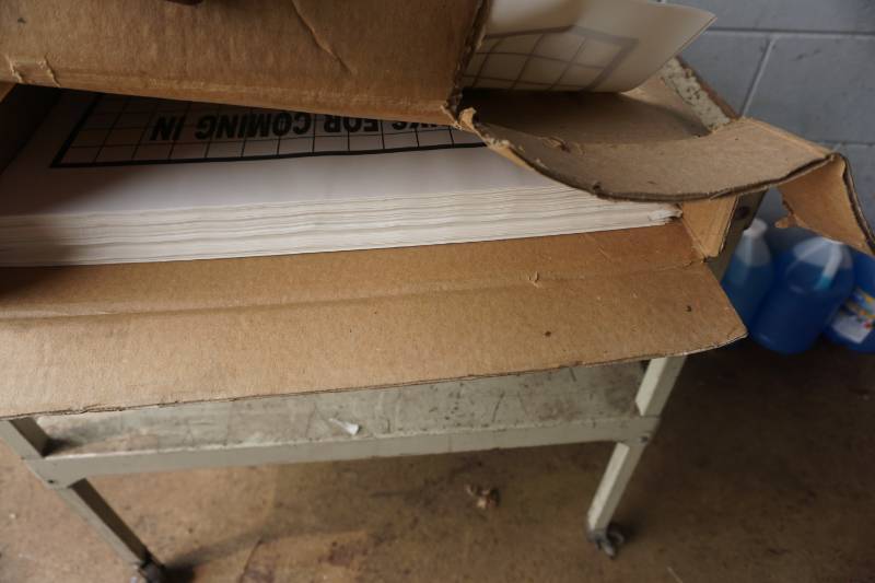 lot 125 image: Case Pack of Mechanics Shop Customer Carpet Protective Paper Mats