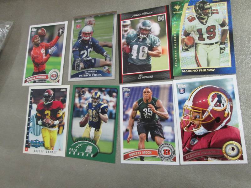 lot 142 image: 40 Football Rookie Cards...