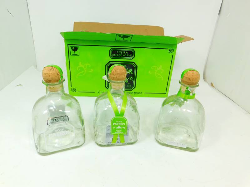 lot 50 image: Three Silver Petron Tequila Bottles