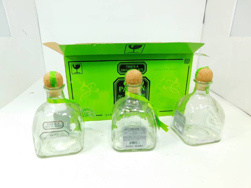 lot 51 image: Three Silver Petron Tequila Bottles