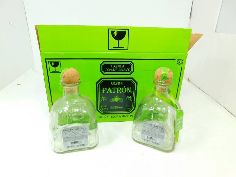 lot 52 image: Two Silver Petron Tequila Bottles