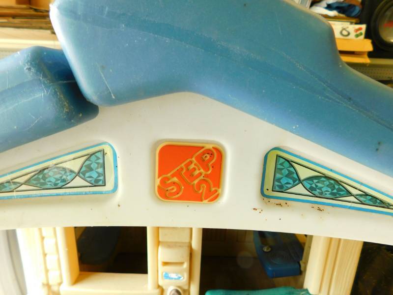 lot 92 image: The Step2 Naturally Playful Front Porch Playhouse features a front porch with built-in bench