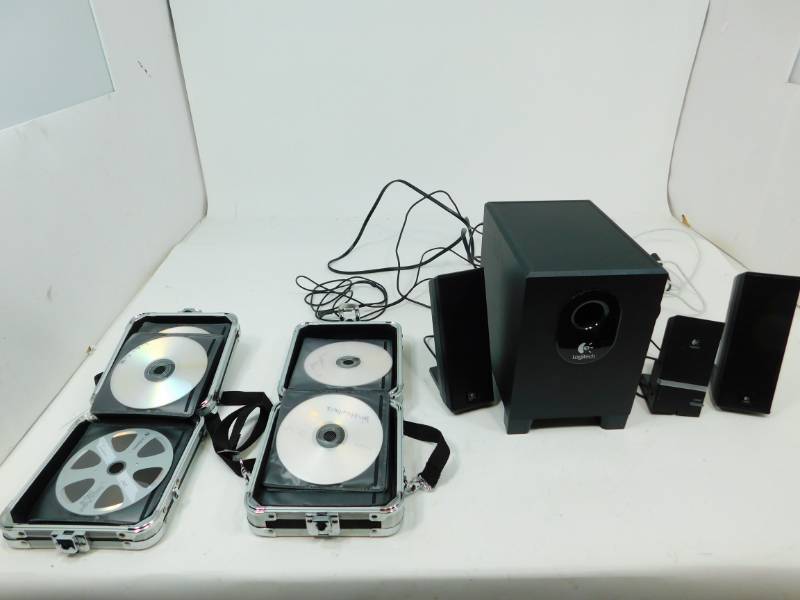 lot 101 image: Logotech Computer Surround Sound Speakers & Two Vaultz Cases Of DVDs & CDs