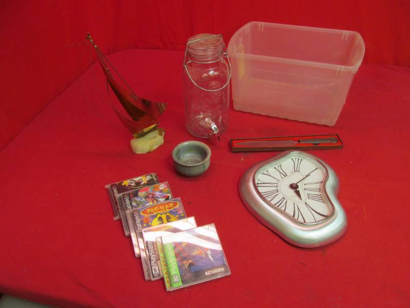 lot 32 image: Play station games, kitchen items ,dcor