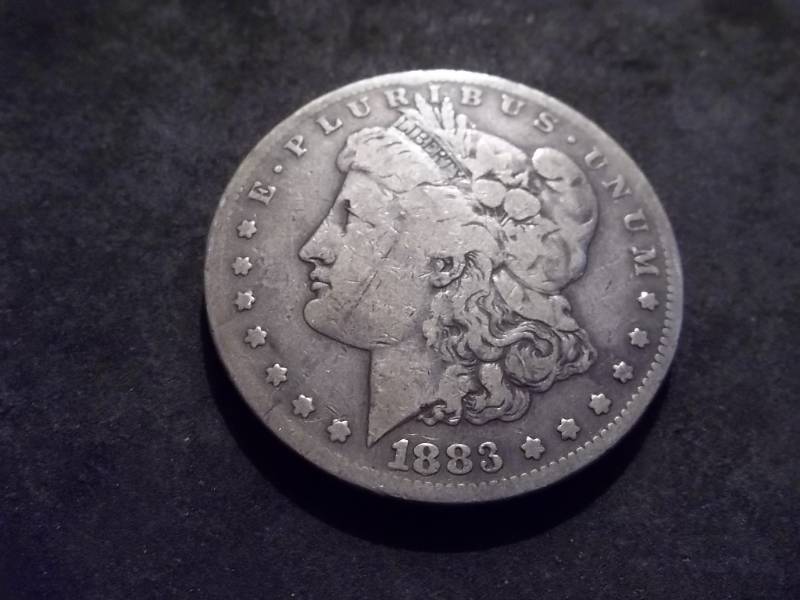 lot 12 image: 1883 S Morgan Silver Dollar