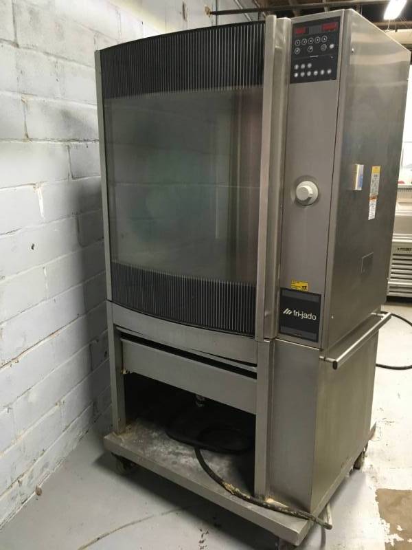 lot 9 image: Fri-Jado STG7-PStainless steel  Single Electric Rotisserie Chicken Meat Baking Pass-Thru Oven used within 5 month no racks minor dents and damages to the unit the tires are broken. Please not winning bidder will need to bring help to remove equipment.