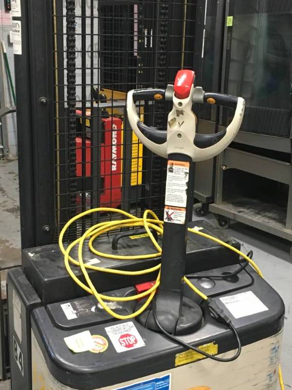 lot 11 image: Crown WS 2300 Walkie Straddle Stacker - Walk Behind Forklift Used with in 5 month, equipment has some  tear and wear. Please note winning bidder will need to bring help to remove equipment.
