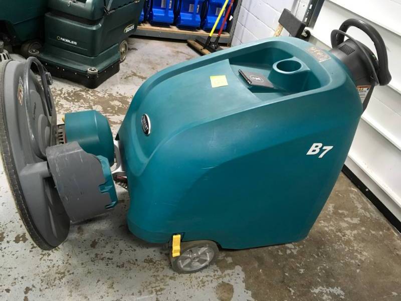 lot 13 image: TENNANT B7 27-inch Walk Behind Battery Floor Burnisher Machine, used with in the last 5 month, some tear and wear please note winning bidder will need to bring help to remove item.