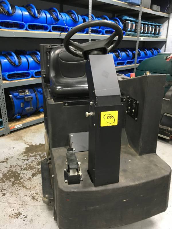 lot 17 image: NSS Champ 3329 Riding Floor Scrubber used with in the last 5 month, some tear and wear. Please note winning bidder will need to bring help to remove equipment.
