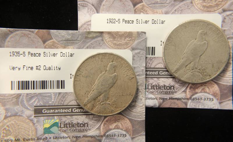 lot 75 image: (2) PEACE SILVER DOLLARS 1922-S F & 1935-S VF