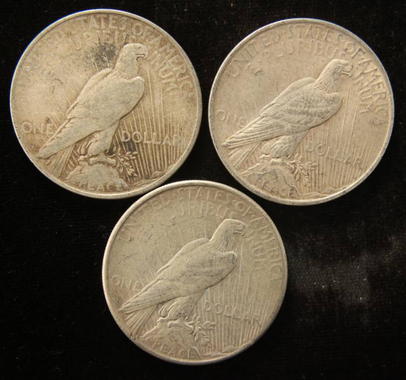 lot 76 image: (3) PEACE SILVER DOLLARS AS PICTURED