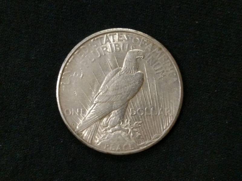 lot 22 image: 1922 S Peace Silver Dollar...