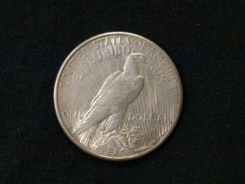 lot 25 image: 1923 S Peace Silver Dollar...