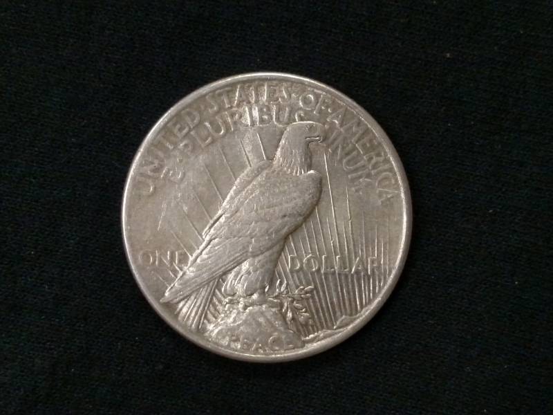 lot 27 image: 1925 Peace Silver Dollar...