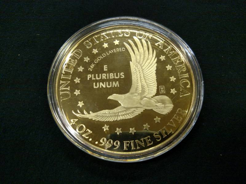 lot 37 image: 2000 Sacagawea Four Ounce Gold Plat...