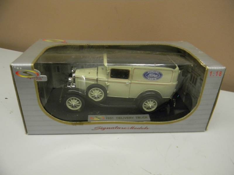 lot 39 image: 1931 FORD DELIVERY TRUCK TAN 118 SCALE DIECAST CAR BY SIGNATURE MODELS - STILL IN BOX - VERY COOL - SEE PICTURES