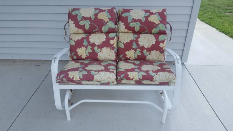 lot 32 image: Double Patio Glider With Cushions, 2-Plastic Adirondak Chairs, 1-Small Table