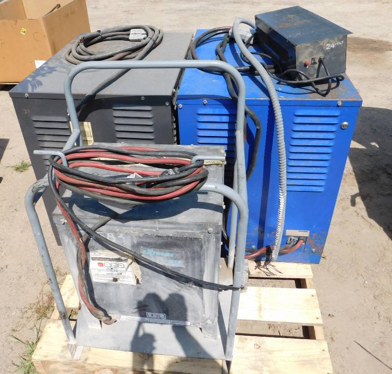 lot 48 image: Three 24 Volt Chargers & One Versa Charger