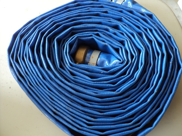 lot 91 image: long blue hose in a bucket...