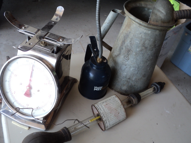 lot 96 image: 2 oil cans, injector, and scale...