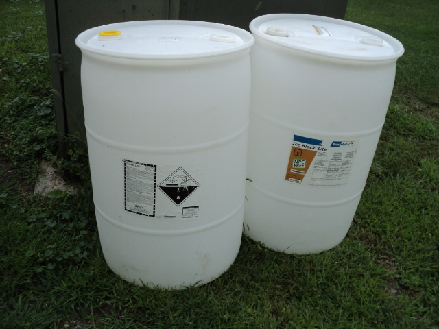 lot 140 image: 2 55 gallon barrels...