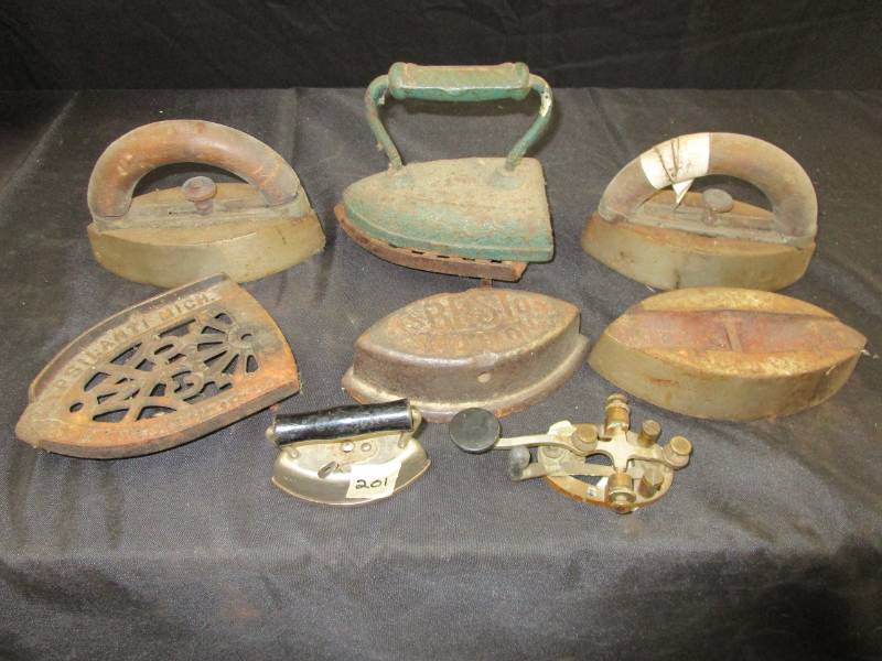 lot 53 image: Antique irons and phone piece