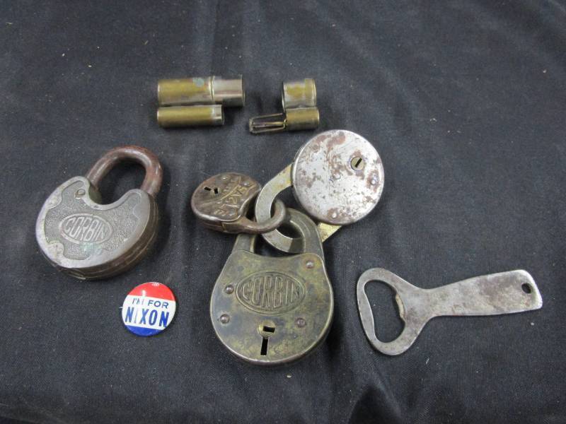 lot 70 image: Various old Corbin and Eagle locks, Jacob Schmidt Brewinfg Company bottle opener, Nixon Pin and more