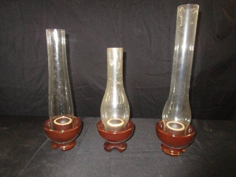 lot 95 image: Insulator candle holders with Aladdin Chimney and the other two are not labeled but they look it