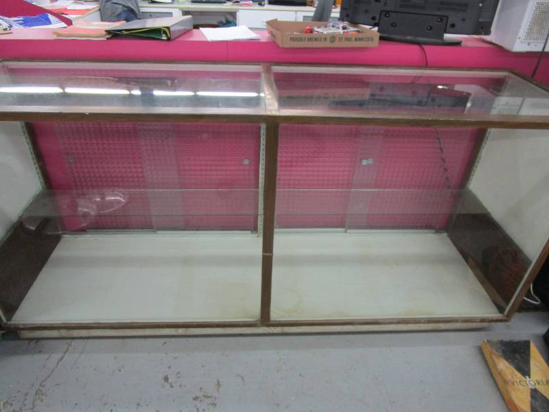 lot 125 image: Nice display case, Sliding glass doors, glass shelf and measures 85 long by 24.5 by 40 deep