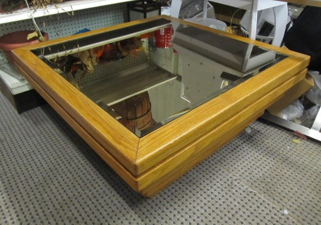 lot 23 image: Vintage Layered Wooden Glass-Top Coffee Table