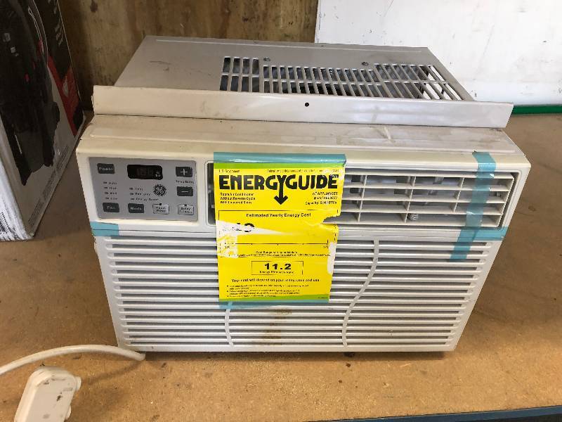 GE 6000 BTU 115-Volt Electronic Room Window Air Conditioner in working conditions