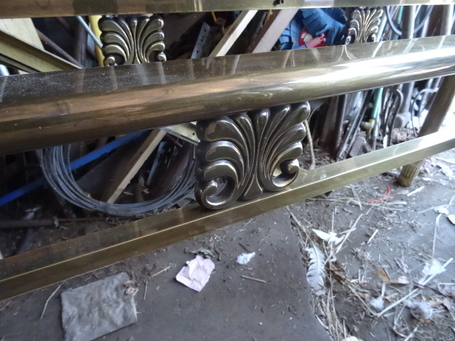 lot 23 image: Brass couch table with glass top in...