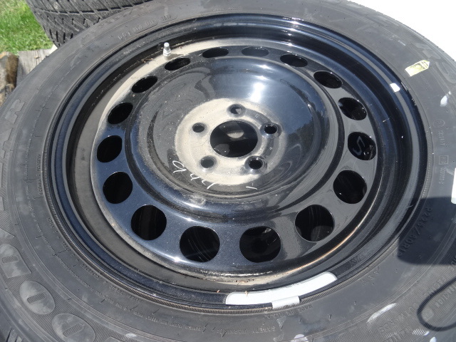 lot 41 image: Like new Goodyear tires with rims. ...