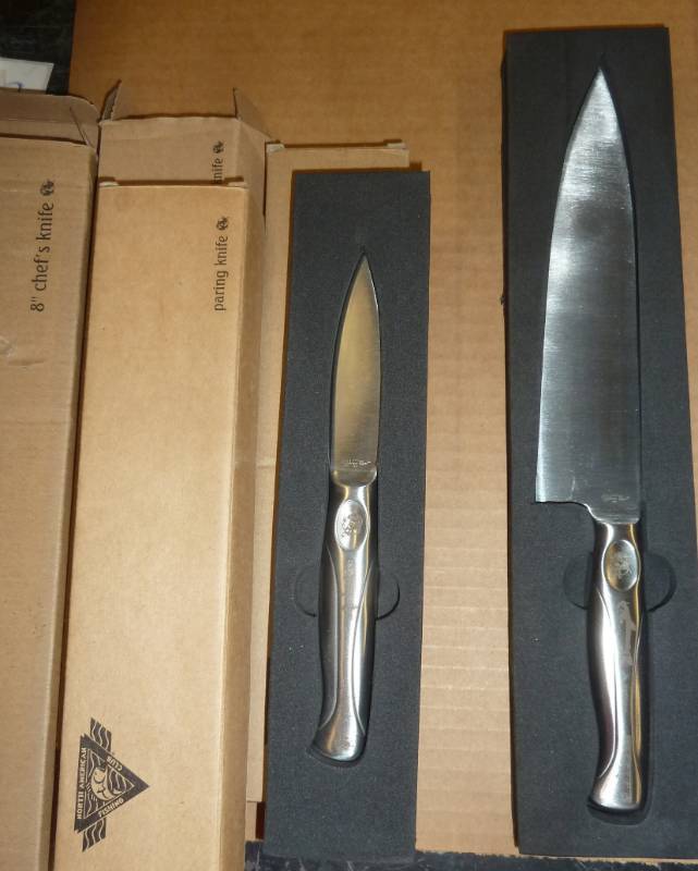 lot 61 image: chef knife and 3 paring knives - fishing theme, different fish etched in the handles of each one
