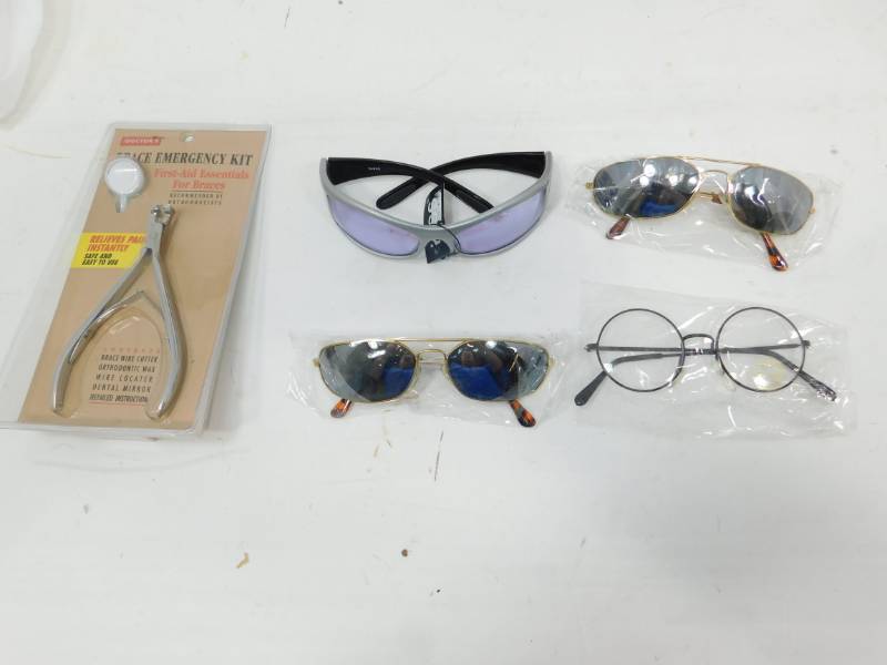 lot 45 image: One Pair Glasses & Three Pair Of Sun Glasses & One Brace Emergency Kit
