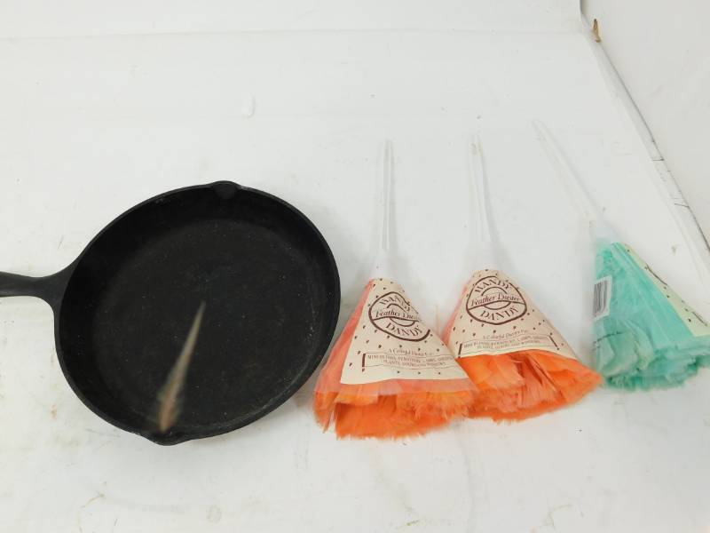 lot 119 image: Lodge Cast Iron Frying Pan--10  & Three Handy Dandy Feather Dusters