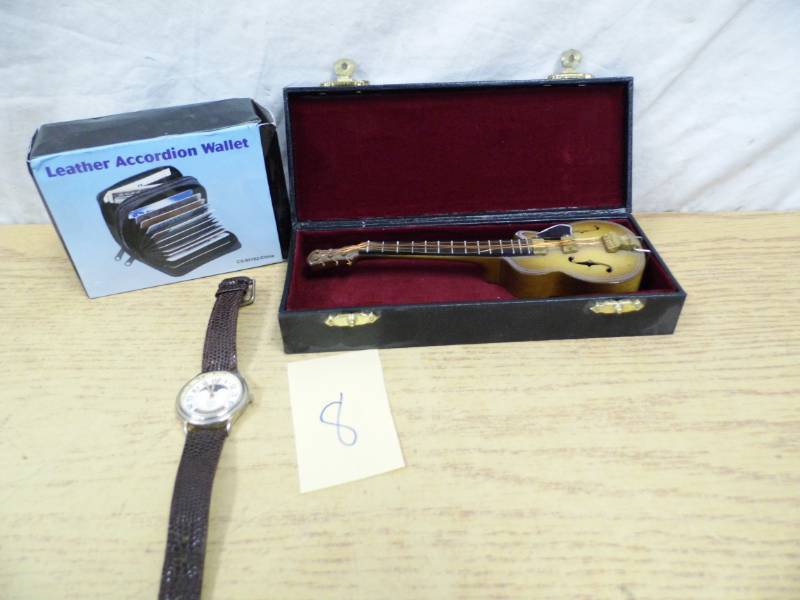 lot 8 image: Wallet - Mini Guitar - Watch