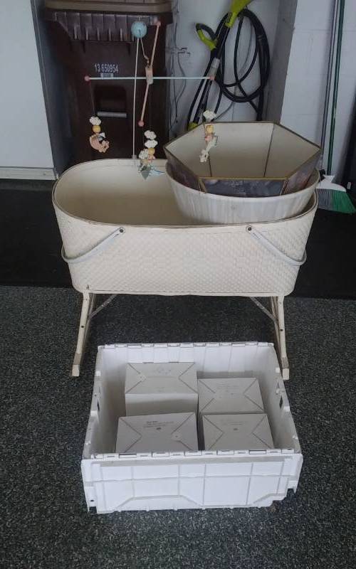 lot 56 image: Tote With 4-Heritage House Figures (County Fair Series), Vintage baby Bassinset Mobile, Blanket, Lamp Shades