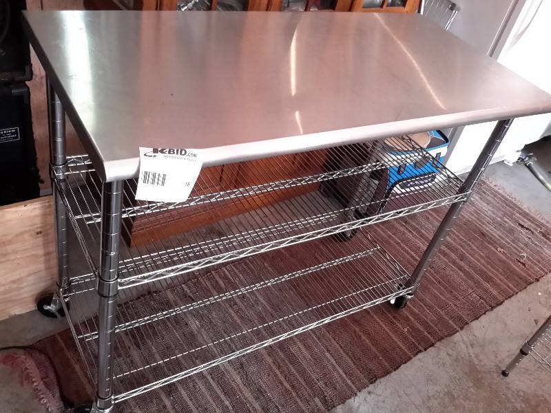 lot 18 image: Stainless Steel Work table on wheels with shelf